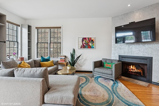 837 W 34th Pl, Chicago, IL 60608 - living area with wood finished floors, a fireplace, recessed lighting, and baseboards