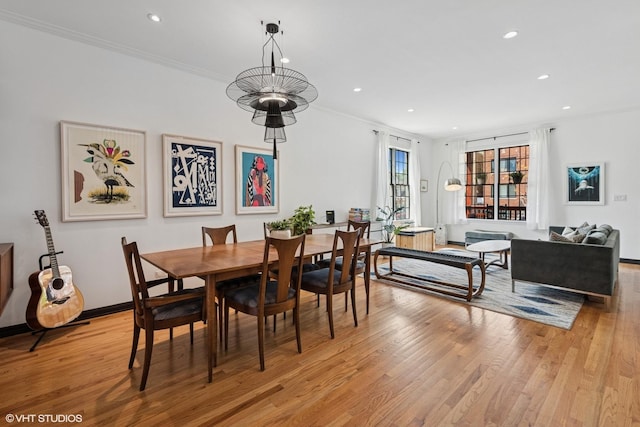 837 W 34th Pl, Chicago, IL 60608 - dining area featuring light wood finished floors, recessed lighting, ornamental molding, and baseboards