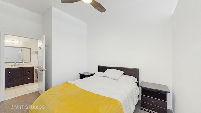 340 W Superior St Unit 1602, Chicago, IL 60654 - bedroom featuring connected bathroom, light tile patterned floors, a sink, and a ceiling fan