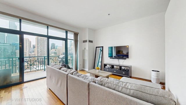 340 W Superior St Unit 1602, Chicago, IL 60654 - living room featuring light wood finished floors and baseboards