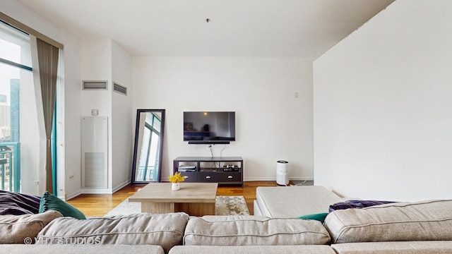 340 W Superior St Unit 1602, Chicago, IL 60654 - living room featuring plenty of natural light, light wood finished floors, and baseboards