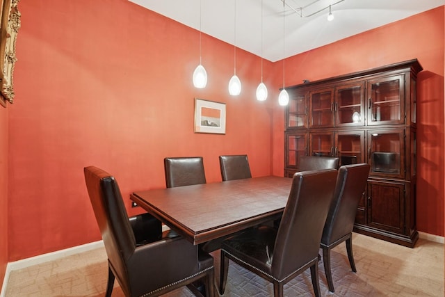 dining space featuring baseboards