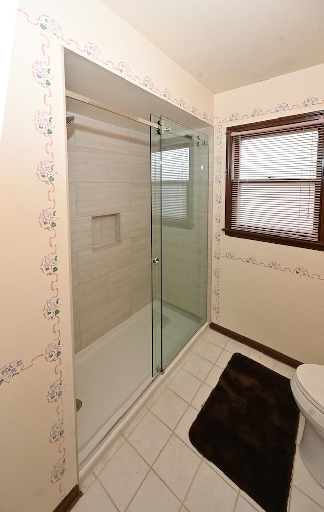 249 S Arlington Heights Rd, Elk Grove Village, IL 60007 - full bath featuring tile patterned floors, toilet, baseboards, and a stall shower