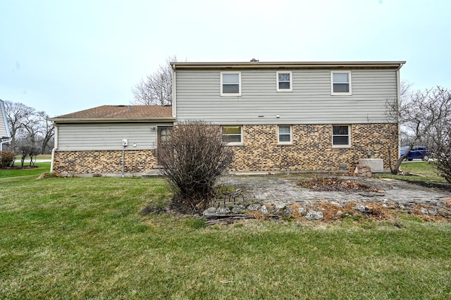 249 S Arlington Heights Rd, Elk Grove Village, IL 60007 - rear view of house featuring a yard, brick siding, and a patio area