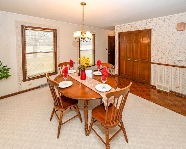 249 S Arlington Heights Rd, Elk Grove Village, IL 60007 - dining space with a chandelier, baseboards, visible vents, and wallpapered walls