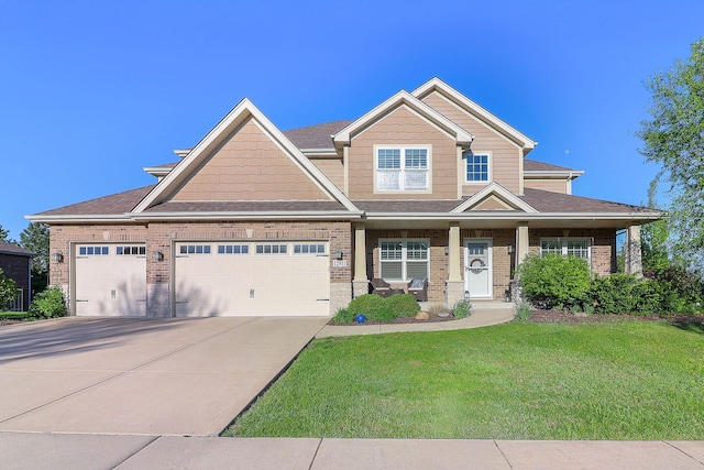 12911 Mayfair Dr, Lemont, IL 60439 - craftsman-style house with a front yard, concrete driveway, a garage, brick siding, and roof with shingles