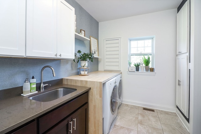 12911 Mayfair Dr, Lemont, IL 60439 - laundry room featuring independent washer and dryer, cabinet space, and baseboards