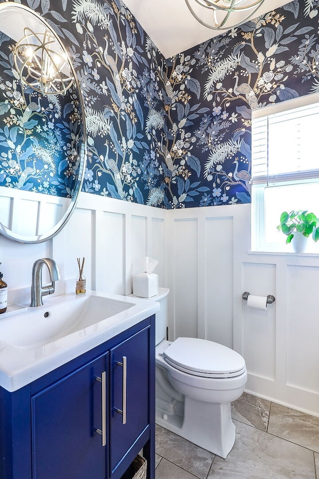 12911 Mayfair Dr, Lemont, IL 60439 - half bathroom featuring a decorative wall, wallpapered walls, toilet, wainscoting, and vanity