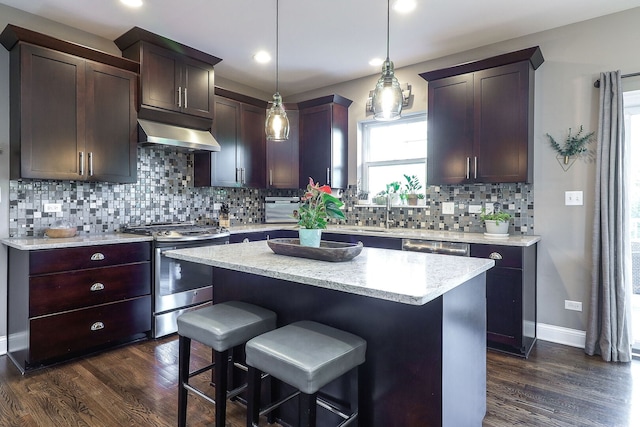 12911 Mayfair Dr, Lemont, IL 60439 - kitchen featuring stainless steel range with gas cooktop, under cabinet range hood, dark wood finished floors, tasteful backsplash, and recessed lighting