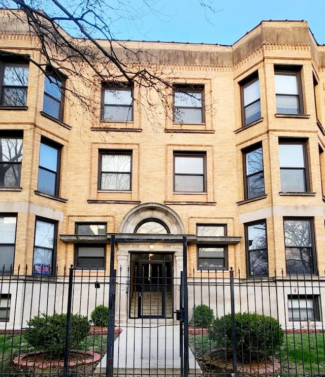 view of property featuring a fenced front yard
