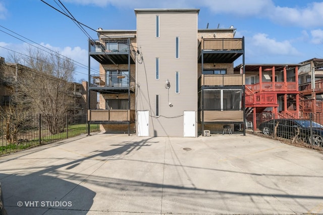 view of building exterior with fence