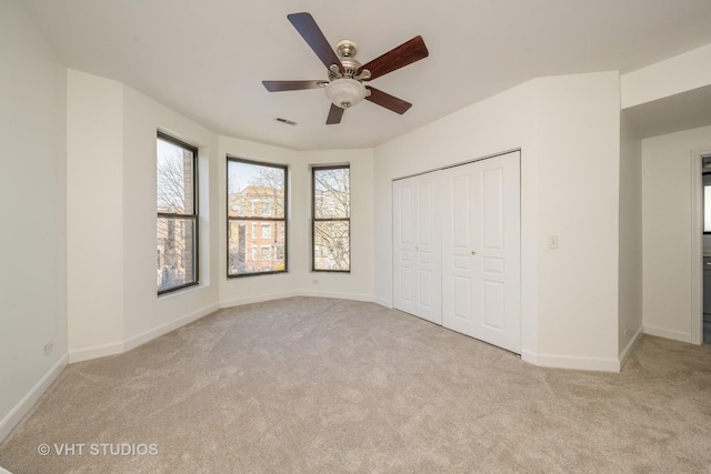 unfurnished bedroom with carpet, baseboards, and visible vents