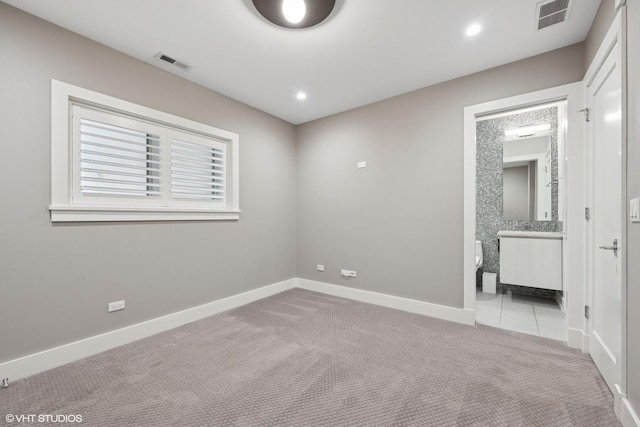 216 S Green St Unit 1N, Chicago, IL 60607 - unfurnished bedroom featuring carpet, baseboards, ensuite bath, tile patterned floors, and recessed lighting