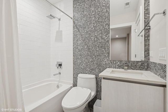 216 S Green St Unit 1N, Chicago, IL 60607 - bathroom featuring toilet, tile walls, vanity, and shower / bathtub combination