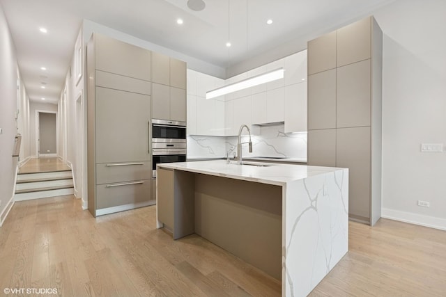 216 S Green St Unit 1N, Chicago, IL 60607 - kitchen featuring a sink, modern cabinets, light wood-style floors, and recessed lighting