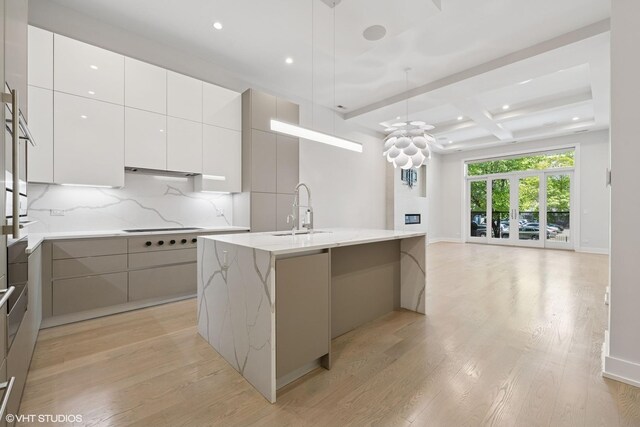 216 S Green St Unit 1N, Chicago, IL 60607 - kitchen with modern cabinets, a sink, light wood-style floors, backsplash, and recessed lighting