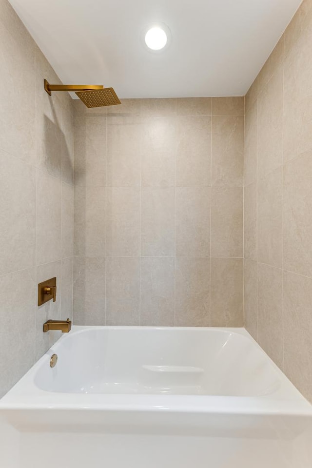 bathroom with tile walls and recessed lighting