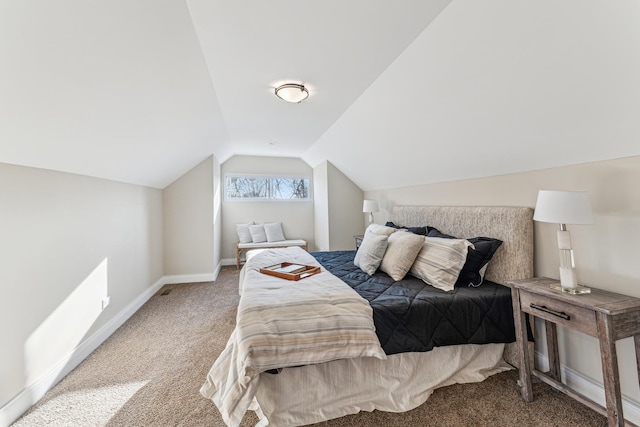 carpeted bedroom with lofted ceiling and baseboards