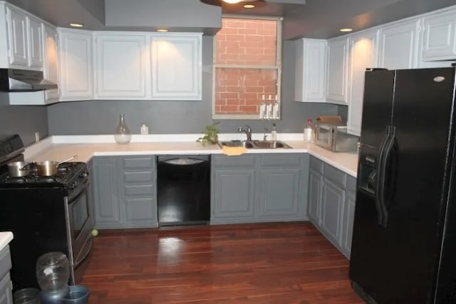 1629 N Halsted St, Chicago, IL 60614 - kitchen with black appliances, a sink, under cabinet range hood, and gray cabinetry