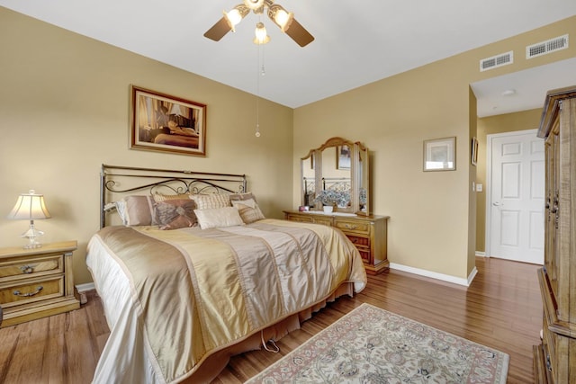 390 S Western Ave Unit 703, Des Plaines, IL 60016 - bedroom featuring baseboards, ceiling fan, visible vents, and wood finished floors