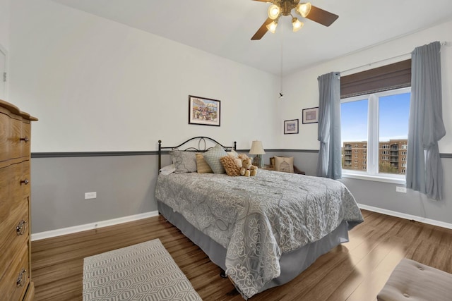 390 S Western Ave Unit 703, Des Plaines, IL 60016 - bedroom with baseboards, ceiling fan, and wood finished floors