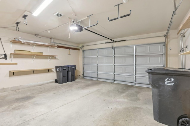 garage featuring a garage door opener