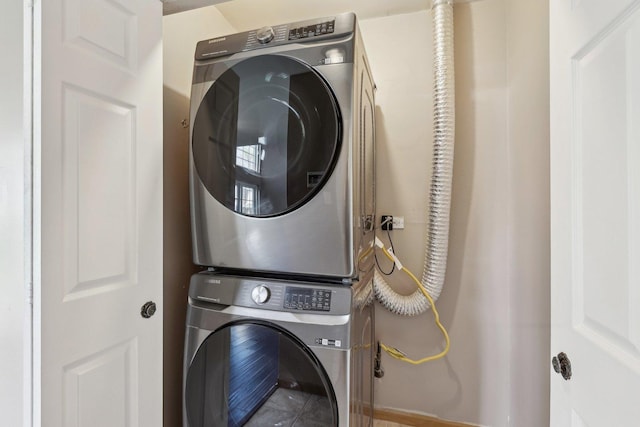 laundry room featuring stacked washer / dryer
