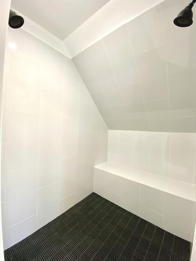 full bath with tile patterned flooring and a tile shower