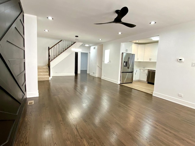 unfurnished living room featuring dark wood-style flooring, baseboards, a ceiling fan, and recessed lighting