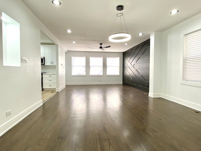 unfurnished living room featuring baseboards, recessed lighting, and ceiling fan