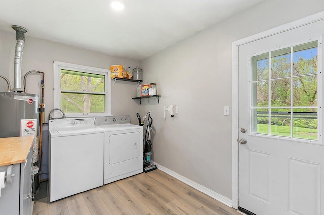 4603 Bonner Dr, Mchenry, IL 60050 - laundry room with water heater, washer and dryer, light wood-type flooring, and plenty of natural light