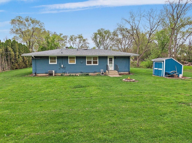 4603 Bonner Dr, Mchenry, IL 60050 - rear view of house featuring a storage unit, a yard, an outdoor structure, and cooling unit
