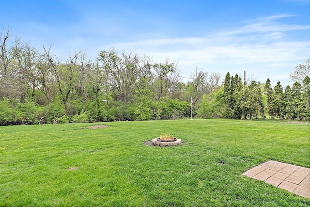 4603 Bonner Dr, Mchenry, IL 60050 - view of green lawn featuring an outdoor fire pit