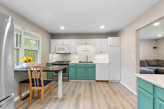4603 Bonner Dr, Mchenry, IL 60050 - kitchen with stainless steel appliances, light wood-type flooring, a sink, recessed lighting, and baseboards