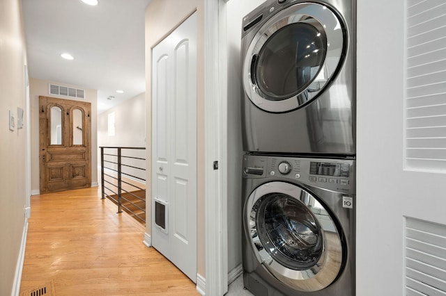 2033 W Rice St Unit 3, Chicago, IL 60622 - clothes washing area featuring stacked washing machine and dryer, light wood-type flooring, baseboards, and recessed lighting