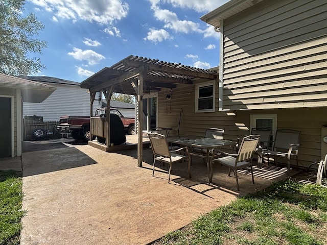 view of patio / terrace featuring a pergola and outdoor dining space