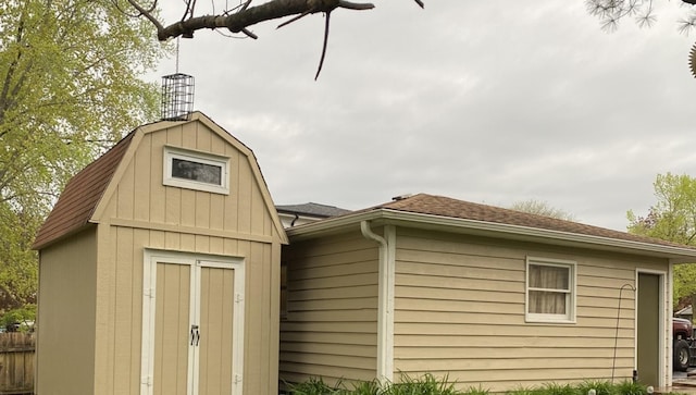 view of shed with fence