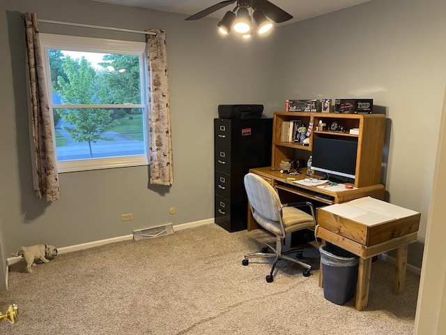 carpeted office featuring ceiling fan, baseboards, and visible vents