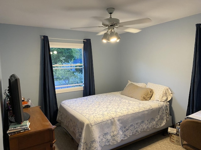 bedroom featuring ceiling fan and carpet