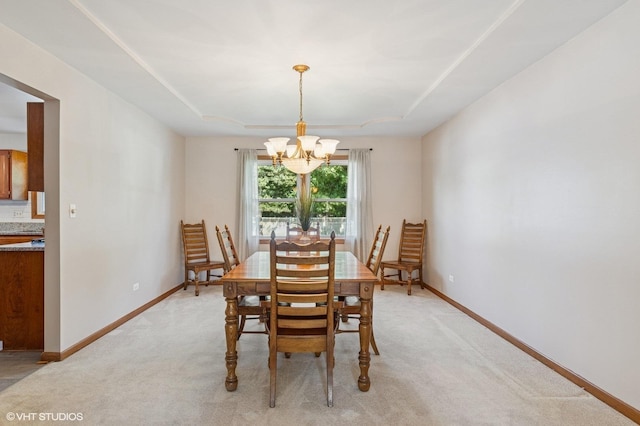 2020 Saint Andrews Dr, Plainfield, IL 60586 - dining area with a chandelier, light carpet, and a raised ceiling