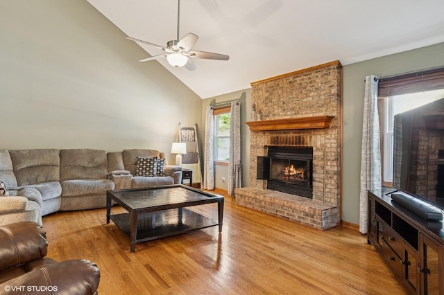 2020 Saint Andrews Dr, Plainfield, IL 60586 - living room with a fireplace, a ceiling fan, light wood-style floors, and high vaulted ceiling