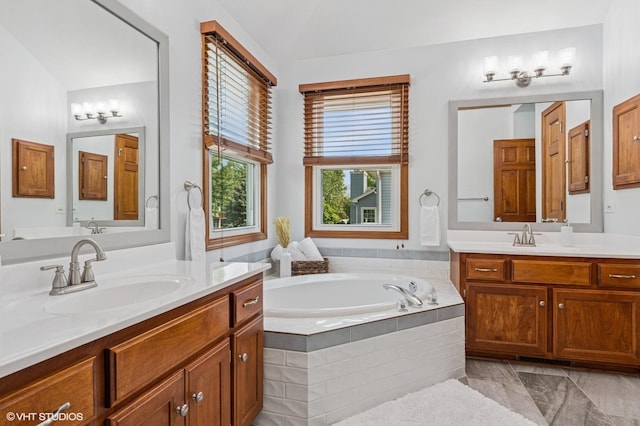 2020 Saint Andrews Dr, Plainfield, IL 60586 - full bathroom with two vanities, a bath, and lofted ceiling