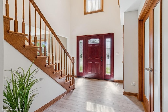 2020 Saint Andrews Dr, Plainfield, IL 60586 - foyer entrance with a towering ceiling, wood finished floors, and stairway