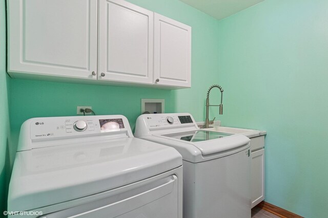 2020 Saint Andrews Dr, Plainfield, IL 60586 - washroom featuring washer and dryer, cabinet space, and wood finished floors