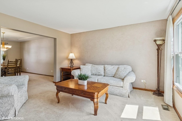 2020 Saint Andrews Dr, Plainfield, IL 60586 - living room featuring a chandelier and light colored carpet