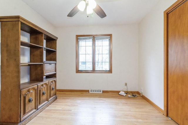 618 Russell Rd, Dekalb, IL 60115 - spare room with light wood finished floors, baseboards, and a ceiling fan