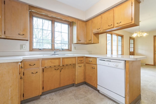 618 Russell Rd, Dekalb, IL 60115 - kitchen with dishwasher, a peninsula, light countertops, a sink, and a chandelier