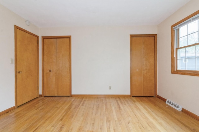 618 Russell Rd, Dekalb, IL 60115 - empty room featuring light wood-style flooring and baseboards