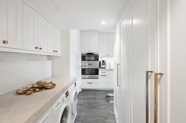1040 N Lake Shore Dr Unit 4C, Chicago, IL 60611 - washroom with recessed lighting, dark marble finish flooring, and washer / dryer