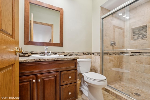 1373 Notre Dame Dr, Lemont, IL 60439 - bathroom with vanity, toilet, a stall shower, tile walls, and wainscoting